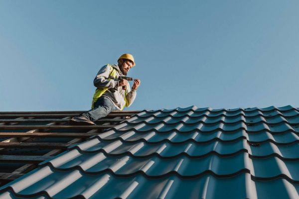 long-shot-man-working-roof-e1645351732290